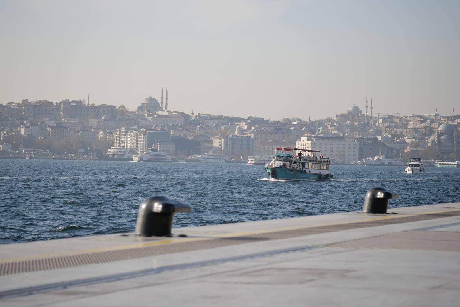 A stunningly beautiful view of Istanbuls picturesque waterfront featuring boats sailing serenely