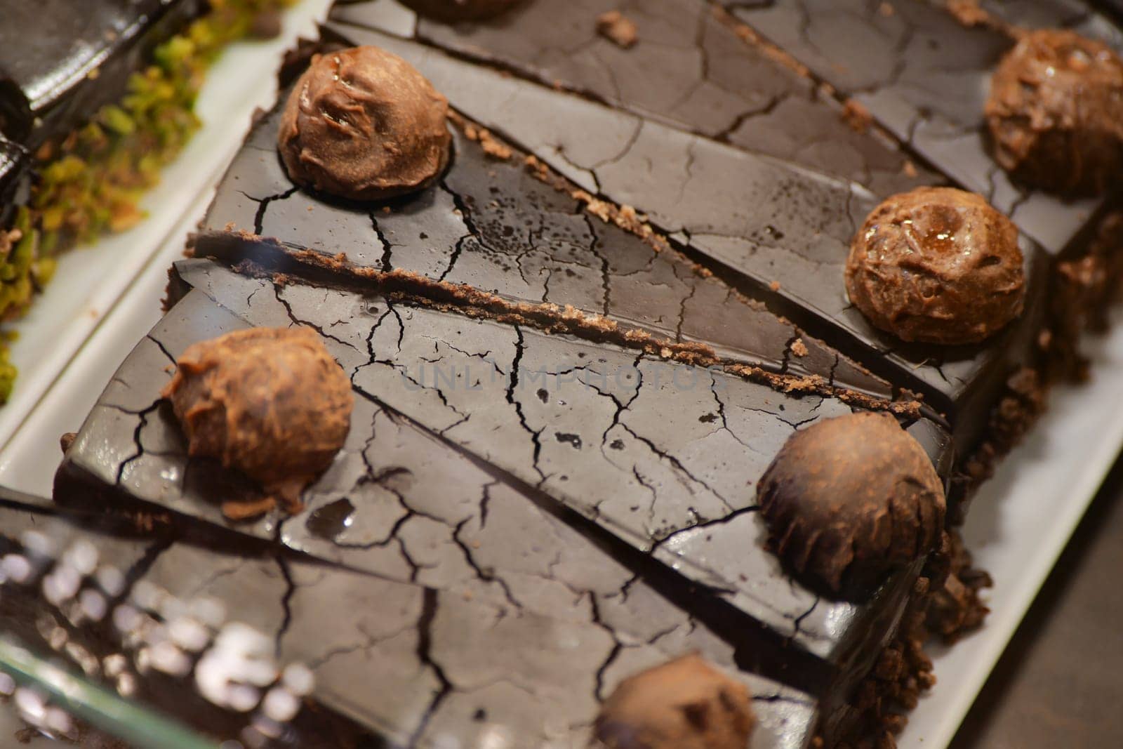 Indulge in our delicious chocolate brownies that are generously topped with rich chocolate truffles