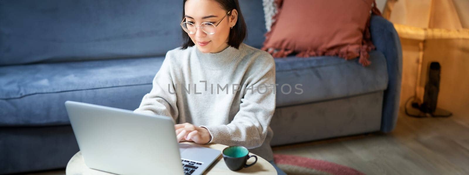 Portrait of working businesswoman using laptop, work on remote. Korean girl with computer, shops online.