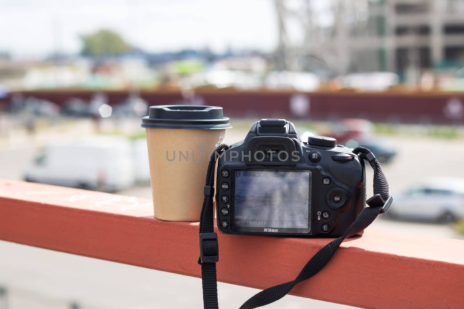 Minsk, Belarus - 9 september, 2023: Nikon camera and cup of coffee by Vera1703