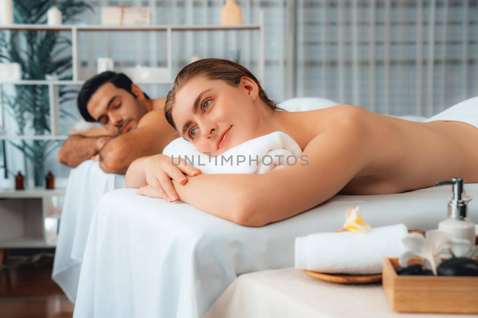 Caucasian couple customer enjoying relaxing anti-stress massage. Quiescent by biancoblue