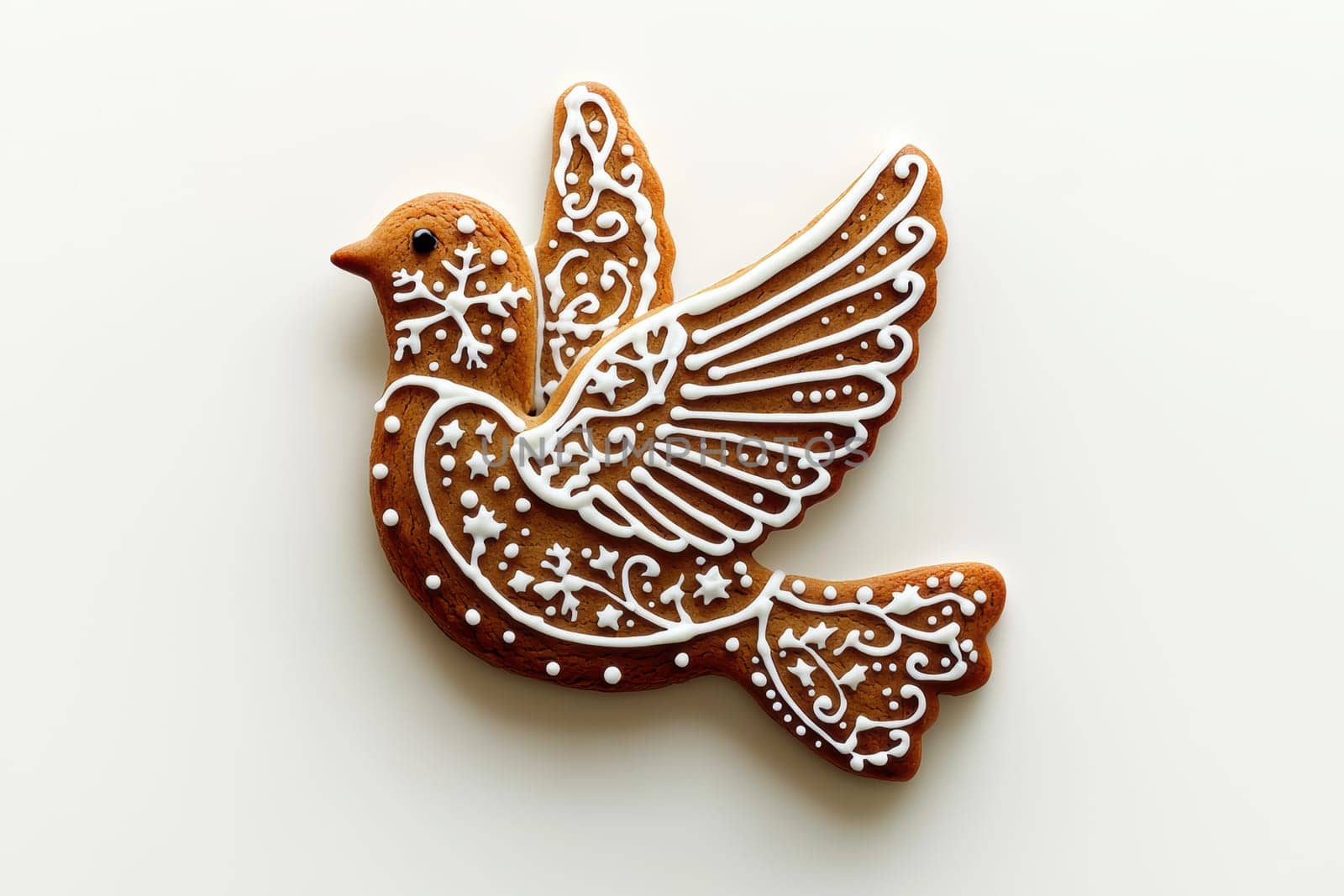 A beautifully crafted gingerbread cookie shaped meticulously like a charming bird, detailed exquisitely with icing