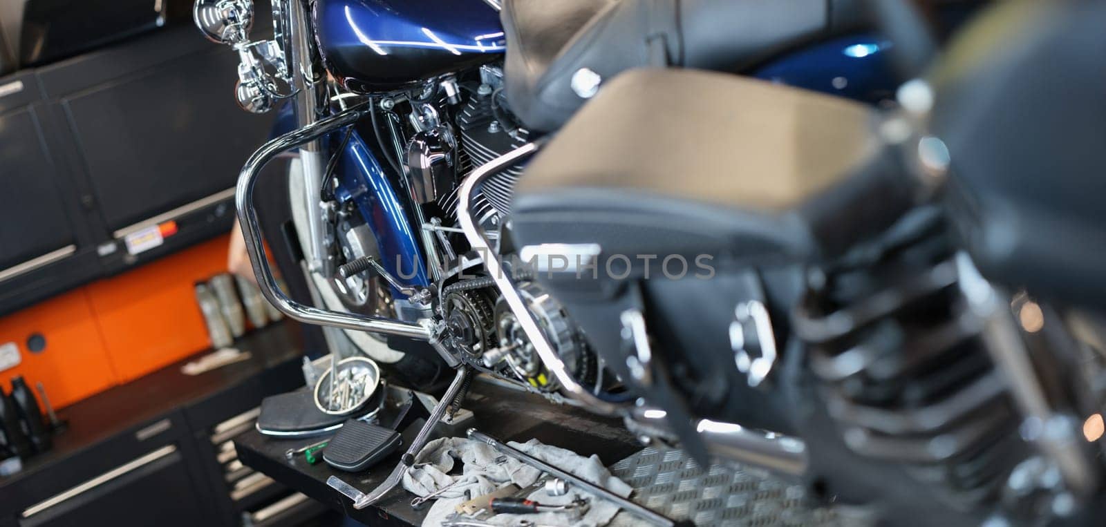 Motorcycle and parts in the garage kitchen, close-up. Pedal replacement, transmission tuning, upgrade motorbike