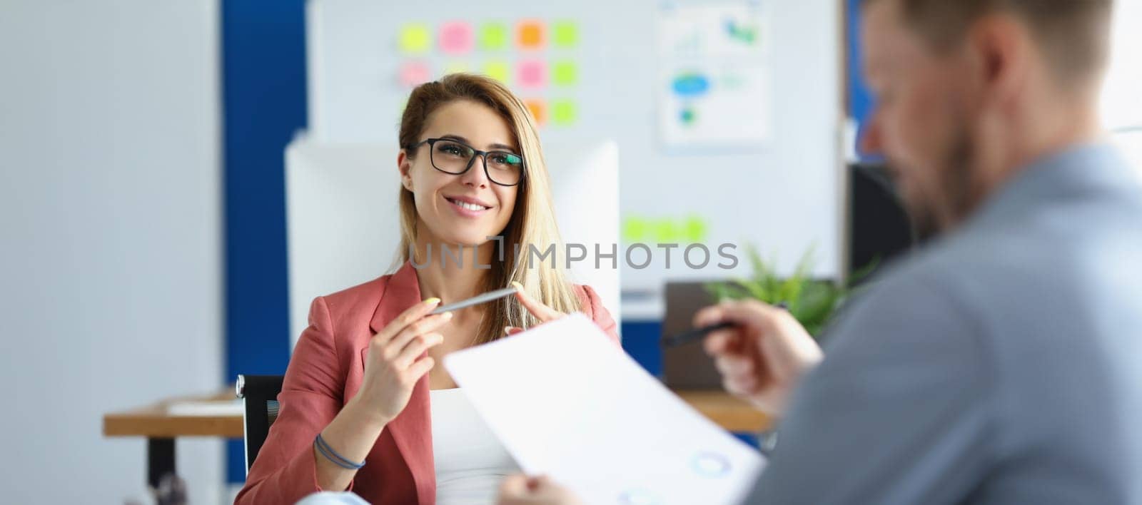 Portrait of cheerful optimistic woman listen to colleague report, office worker in suit. Woman boss proud of her worker. Business, career, strategy concept