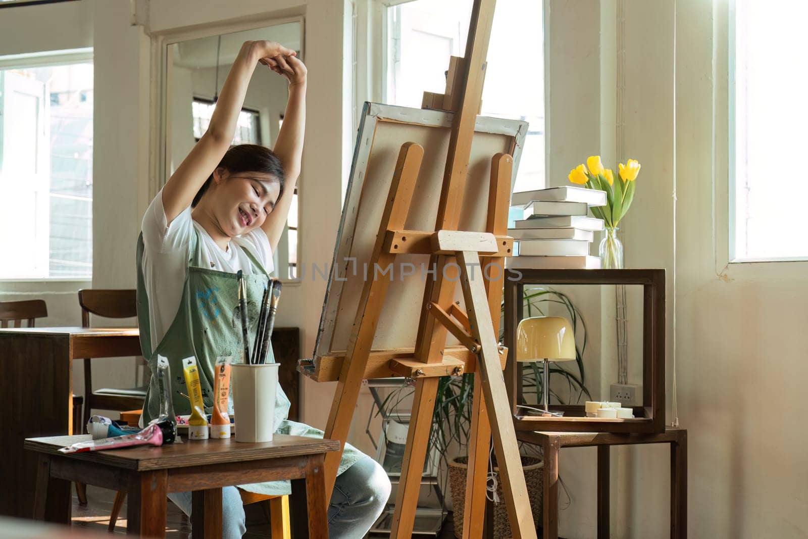 Talented Female Artist Working on a artist lifestyle. painting hobby. woman drawing beautiful watercolor design.