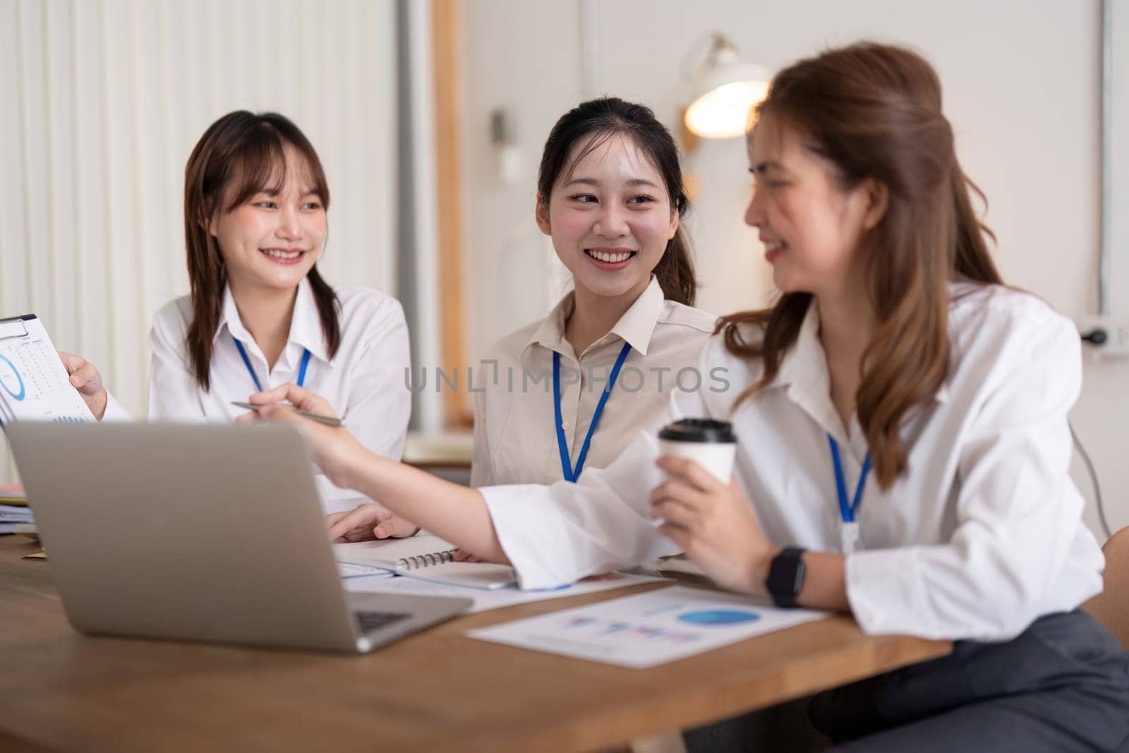 Team employee collaboration discussing working analyzing with financial data and marketing growth report graph in team, brainstorming to strategy planning making profit of company.