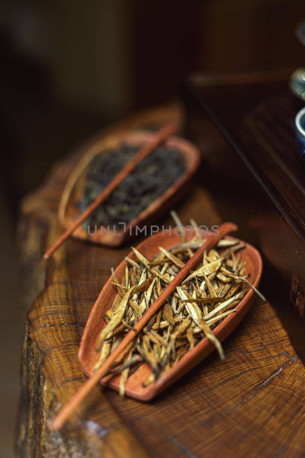 Beautifully arranged herbal ingredients in unique clay bowls, showcasing natural textures and colors.