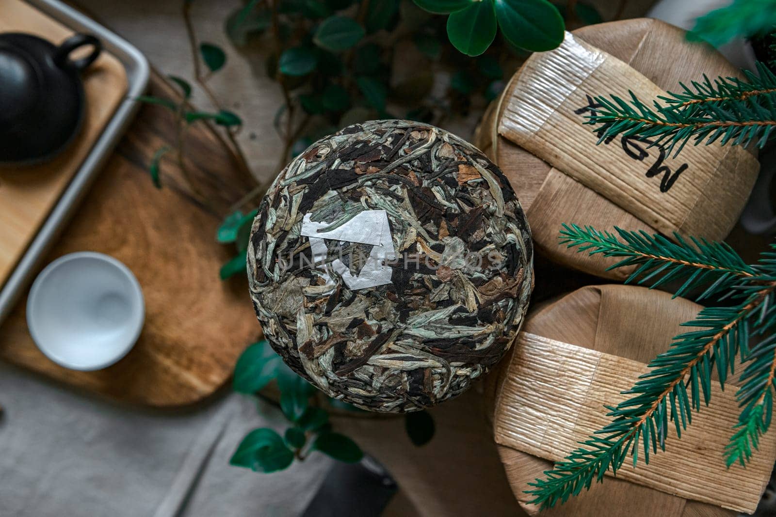 A cozy tea setup with elegant decor and vibrant greenery, exuding tranquility and calmness in the space