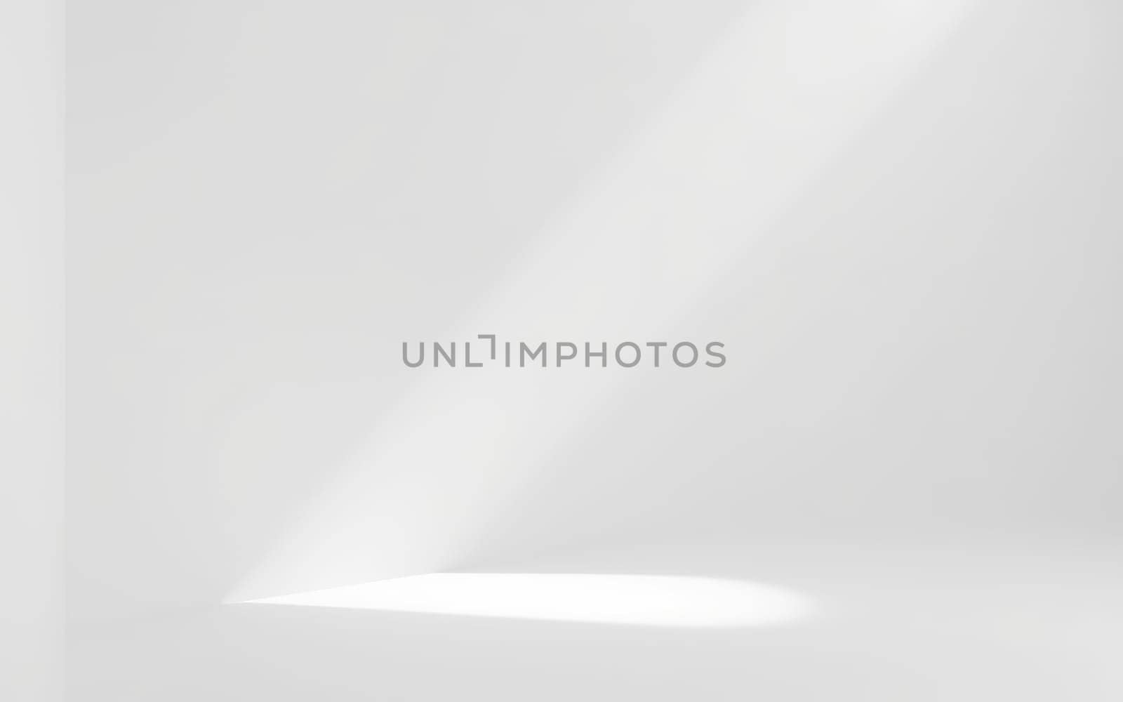 A strong beam of light cuts through a dull grey space, illuminating a small area on the surface below. The composition emphasizes simplicity and focus, creating an intriguing atmosphere.