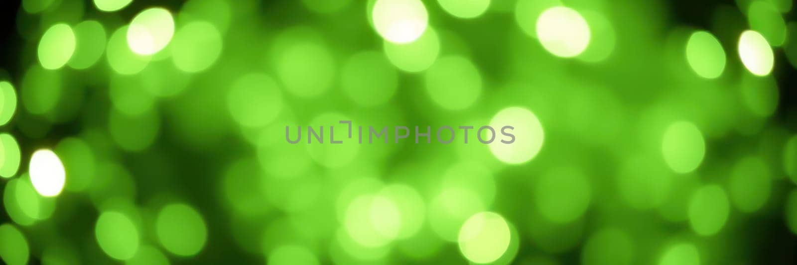 Soft green bokeh lights illuminate the dark surroundings, creating a tranquil and enchanting atmosphere. This captivating display evokes a sense of wonder and calmness.