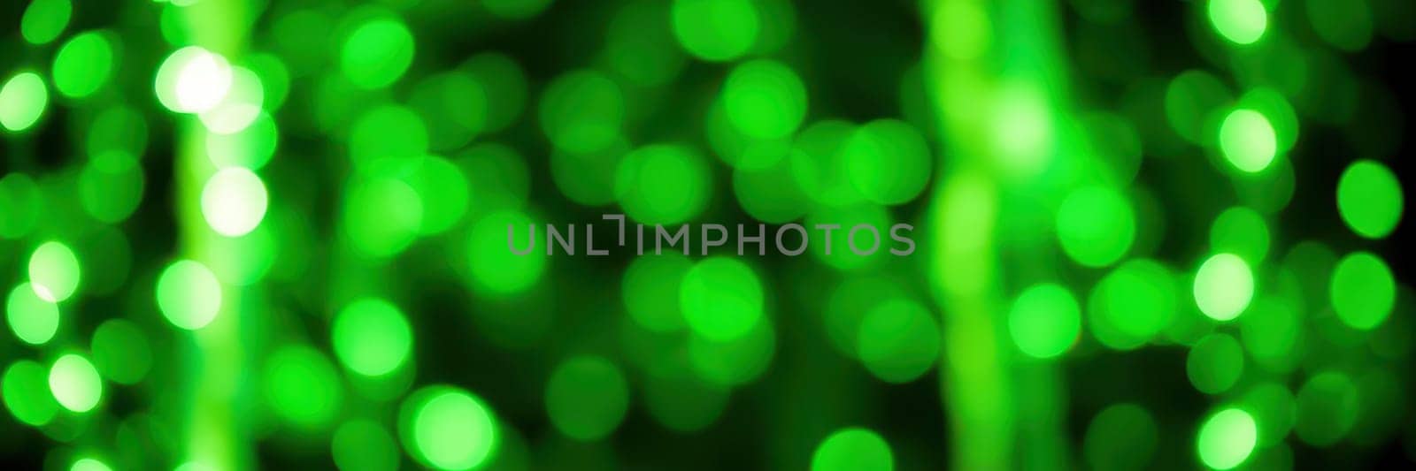 Bright green bokeh lights form a lively backdrop, perfect for festive occasions like parties, holidays, and special events. The soft glow adds a whimsical atmosphere.
