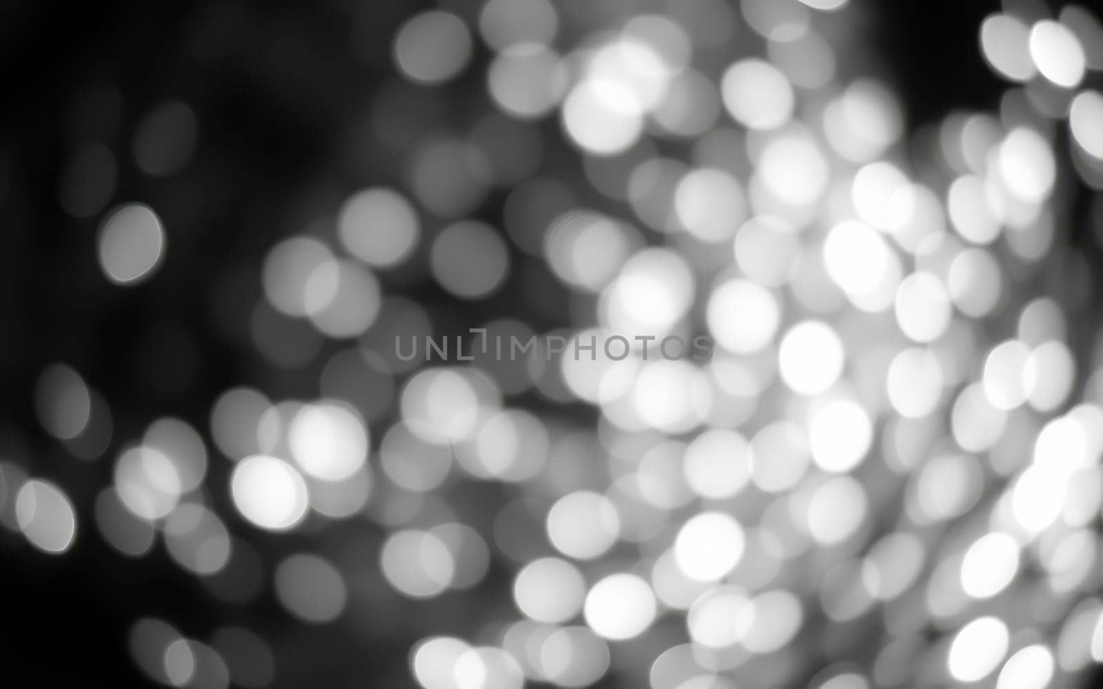 Softly glowing lights fill the background, creating a dreamlike ambiance. The blurred effect enhances the sense of tranquility, evoking feelings of wonder and calm.