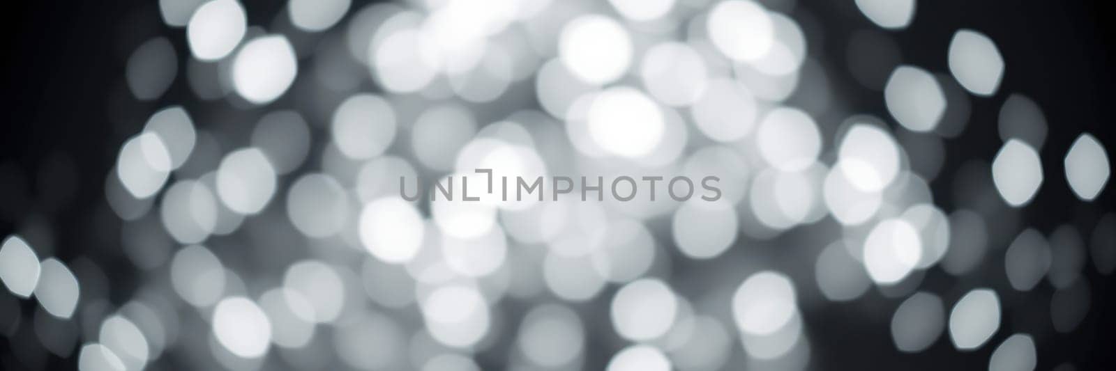 The soft, shimmering lights create a mesmerizing bokeh effect, setting a serene and elegant mood for a special gathering during the evening hours.