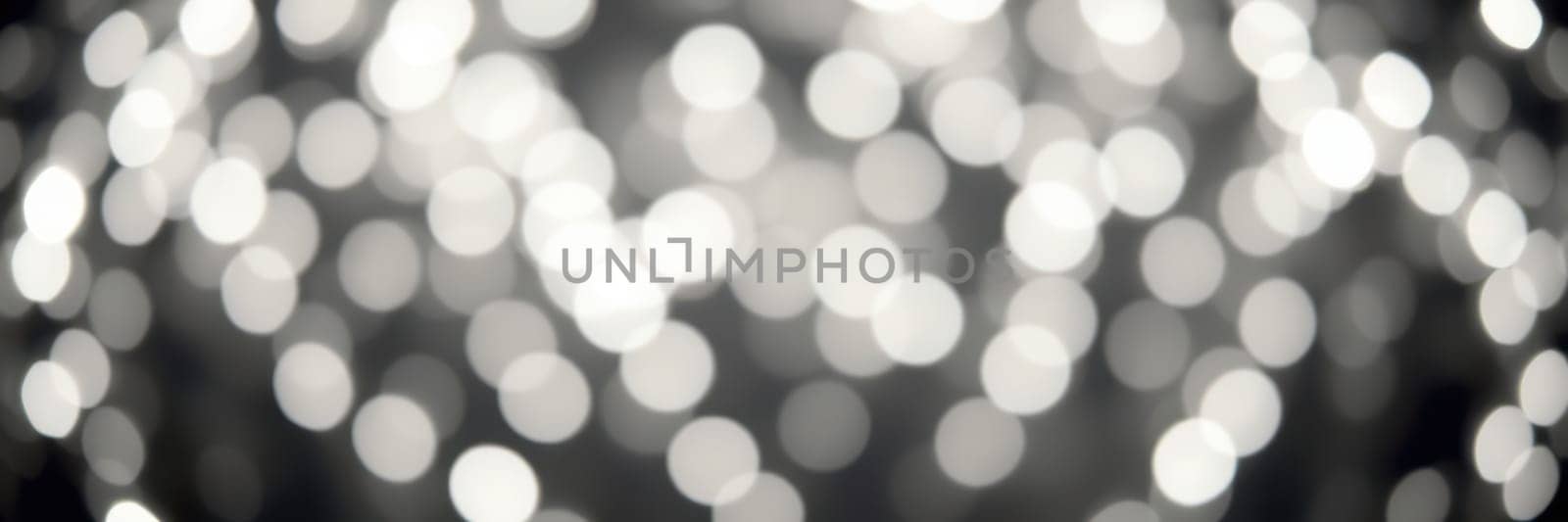 Soft, glowing lights fill the atmosphere with a magical ambiance during an evening celebration. The blurred effect adds a sense of enchantment and joy to the event.