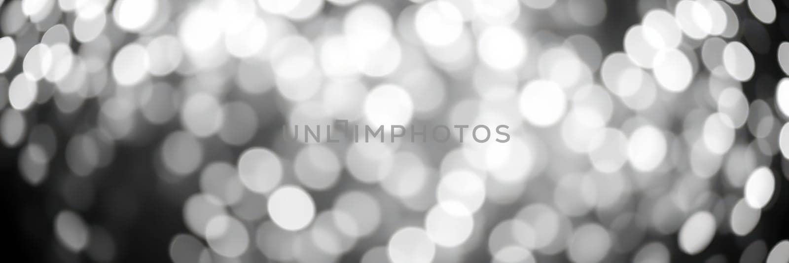 Soft, luminous circles of light blend into a mesmerizing background, enhancing the joyful ambiance of a night filled with celebration and excitement.