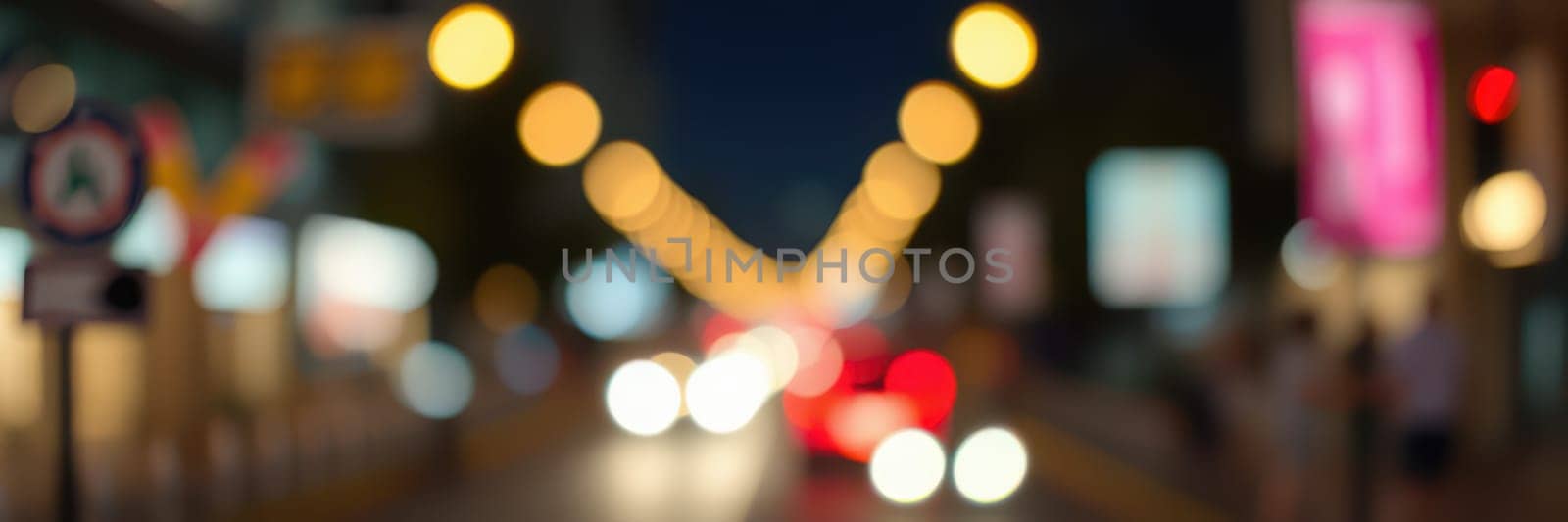Vibrant night life fills the city street with blurred headlights and streetlights creating a dynamic atmosphere. The background exhibits colorful signs and activity from pedestrians.