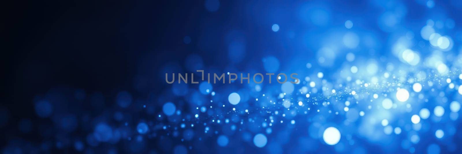 Bright blue bokeh lights sparkle against a dark background, creating a captivating and enchanting ambiance perfect for nighttime celebrations or events.