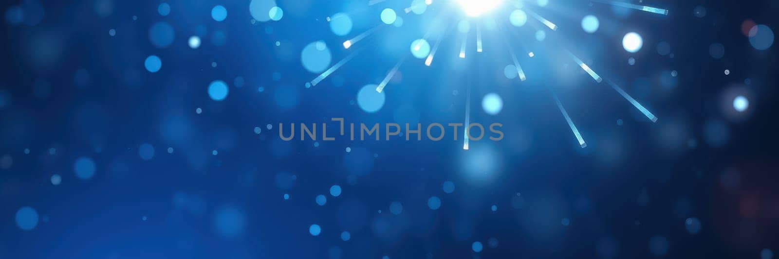 A vibrant display of bright light rays radiates from a central point, creating a stunning blue bokeh effect. This energetic visual evokes a sense of excitement and joy, perfect for special occasions.