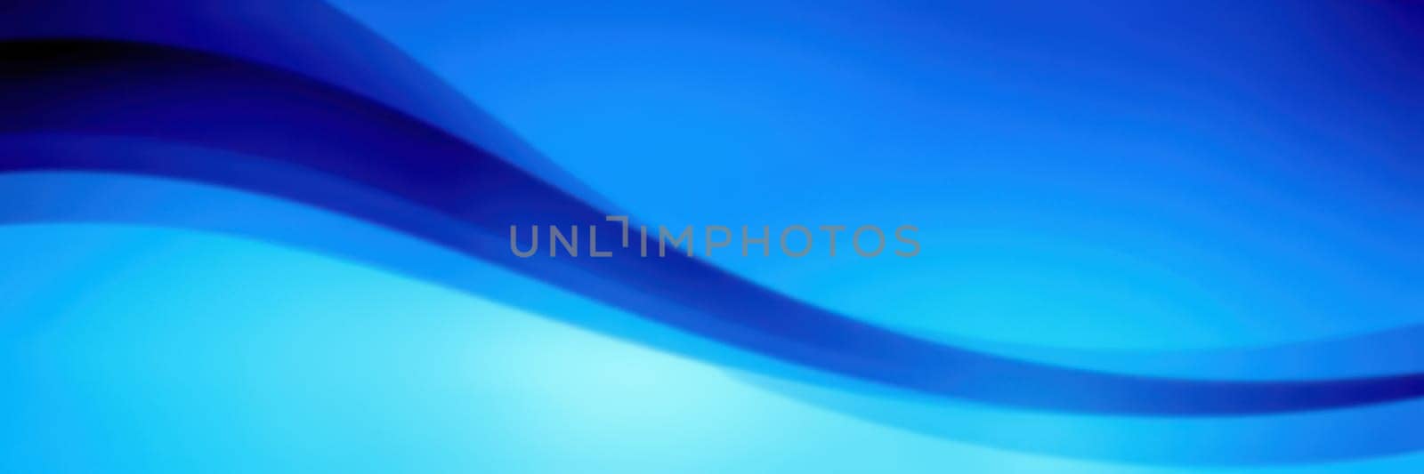 Soft waves of varying blue tones blend seamlessly, creating a calming abstract background that evokes tranquility and peace. Ideal for various design projects or relaxation spaces.