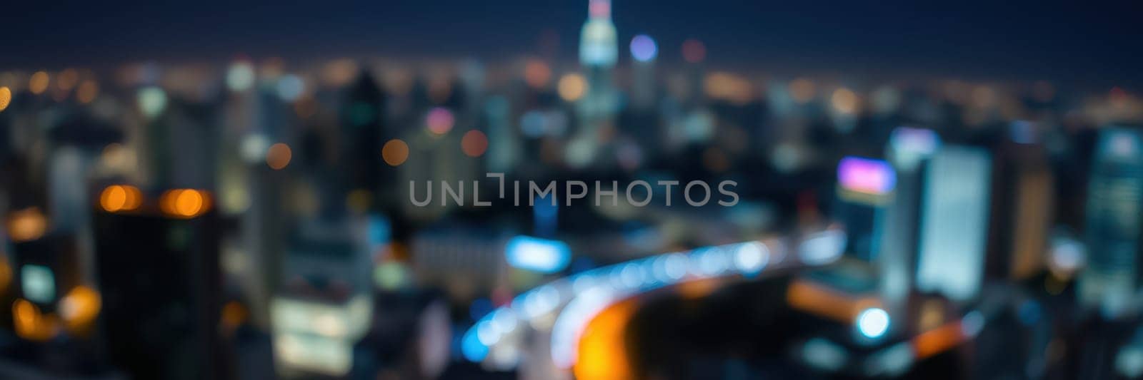 A bustling city skyline glows under the night sky, with bright lights from buildings and streets creating a lively ambiance. The blurred effect adds to the dynamic urban energy.