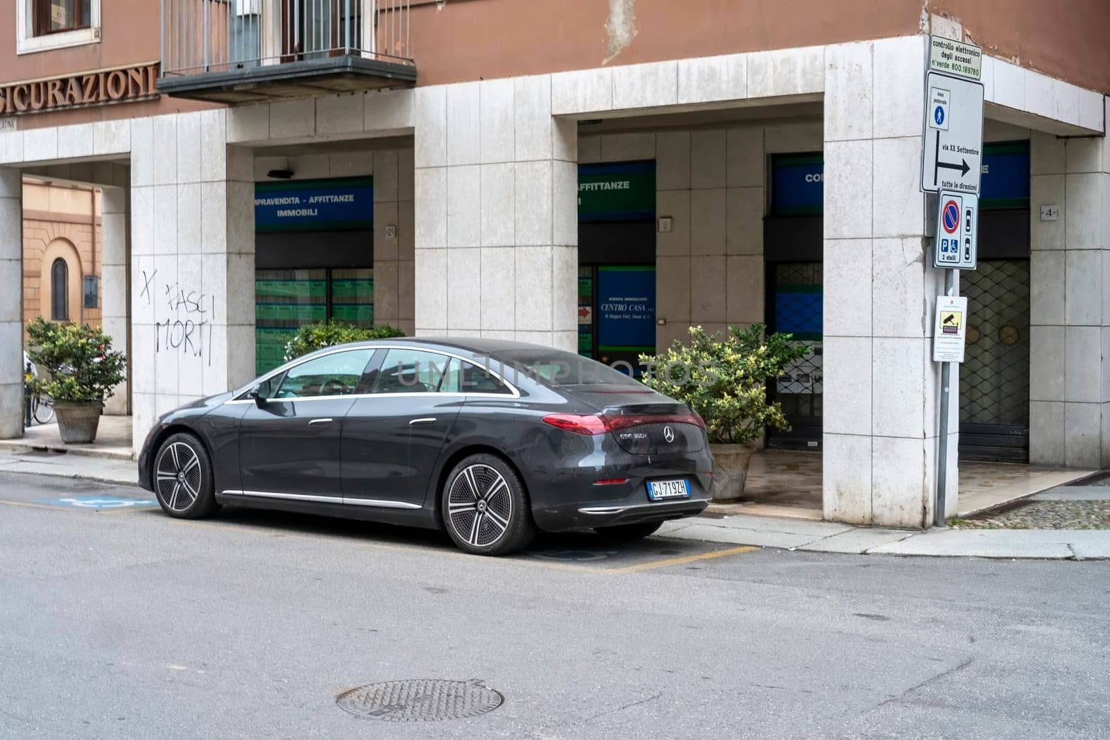 Lombardy, Italy - November 20th 2024 Sleek, gray mercedes-benz eqs 450 electric sedan parked on a city street, showcasing modern automotive design and sustainable transportation