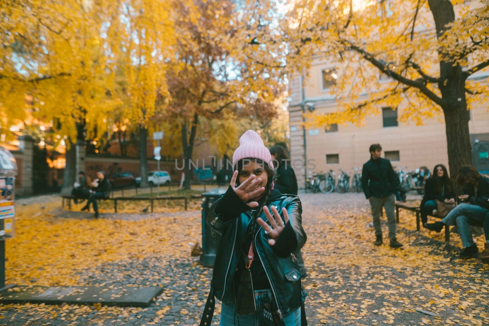 An incredibly vibrant autumn scene beautifully capturing a joyful moment right in a leafstrewn park