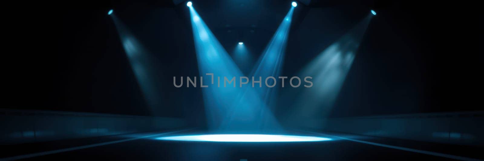 Bright blue spotlights shine down on an empty stage, creating dramatic shadows and a captivating atmosphere. This lighting sets the mood for an upcoming performance or event.