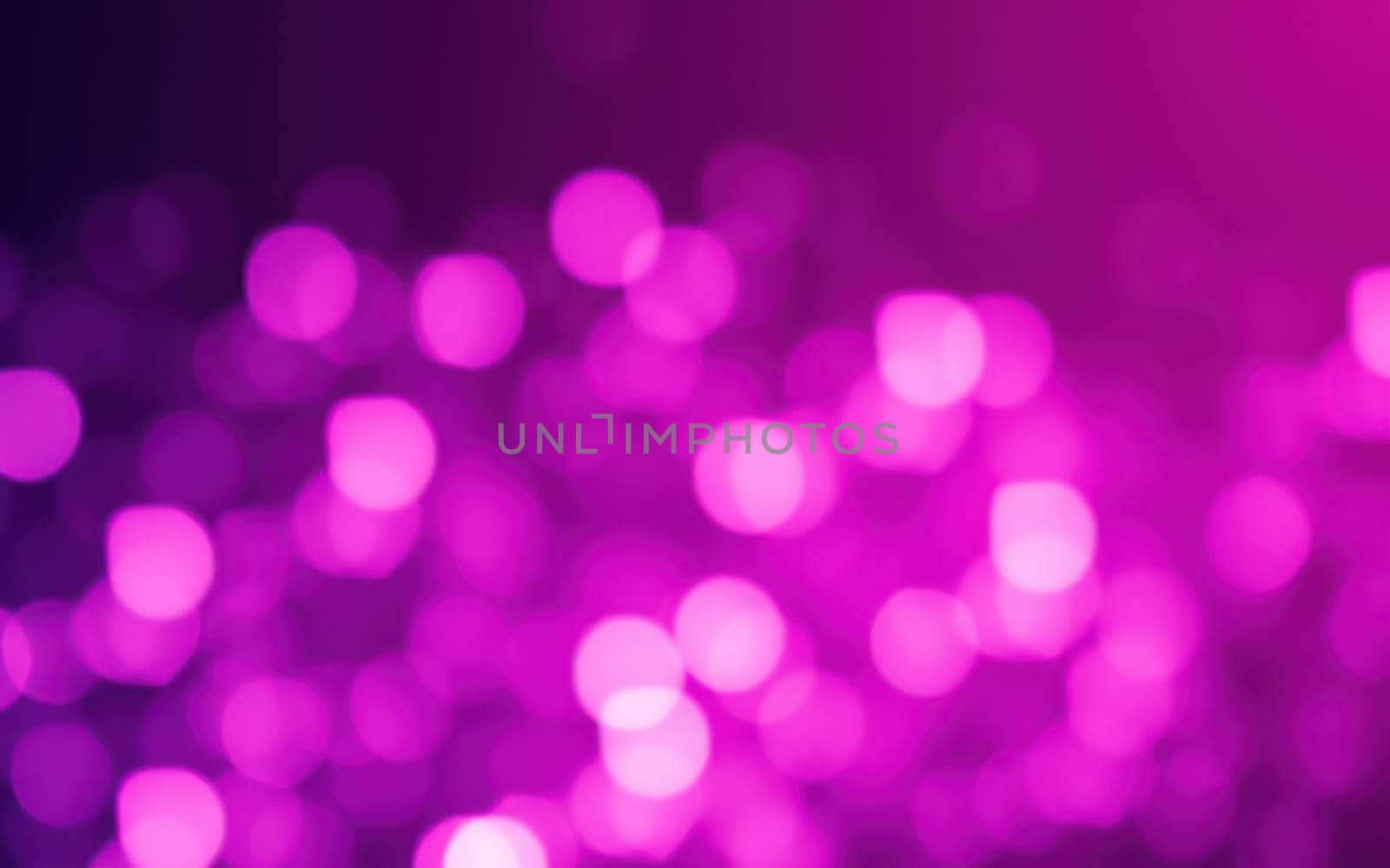 A multitude of blurred purple lights creates an enchanting bokeh effect, representing a lively night scene at an outdoor gathering. The vibrant hues enhance the festive ambiance.