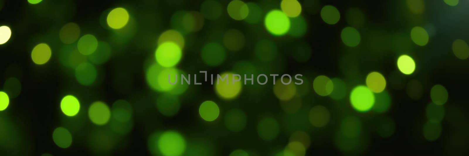 Vibrant green bokeh lights shimmer against a dark background, enhancing the festive ambiance. Perfect for nighttime events, they add a delightful glow to celebrations.