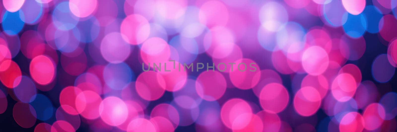 A vivid display of bokeh lights fills the background with shades of pink and blue while setting a lively and cheerful mood for evening festivities and gatherings.