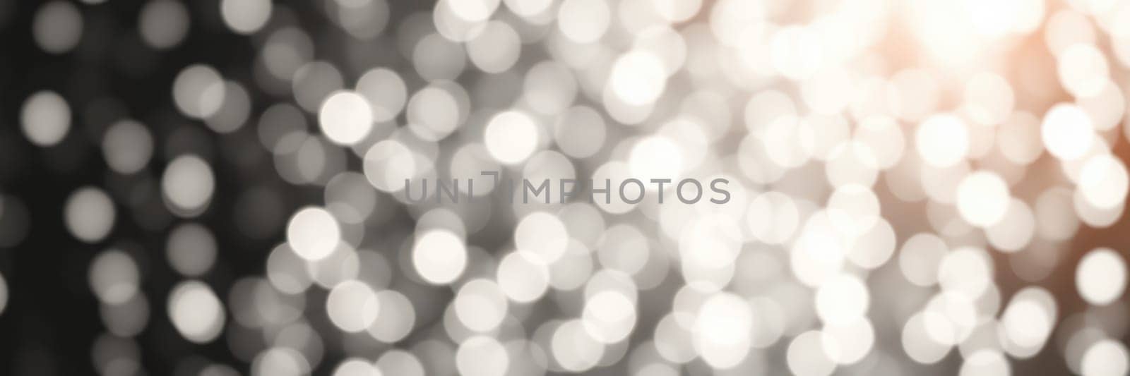Enchanting bokeh lights twinkle against a dark background, creating a magical ambiance during a nighttime celebration, perfect for special events and gatherings.