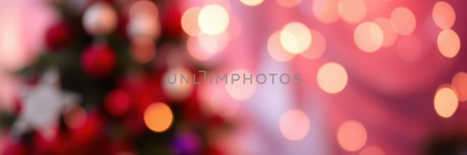 Colorful holiday lights sparkle softly in a cozy setting, enhancing the festive mood as guests prepare to celebrate the joyous season in December.