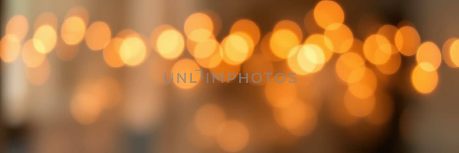 Warm, soft lights create a cozy atmosphere in an indoor setting, perfect for an evening gathering filled with friends and family enjoying each other's company.