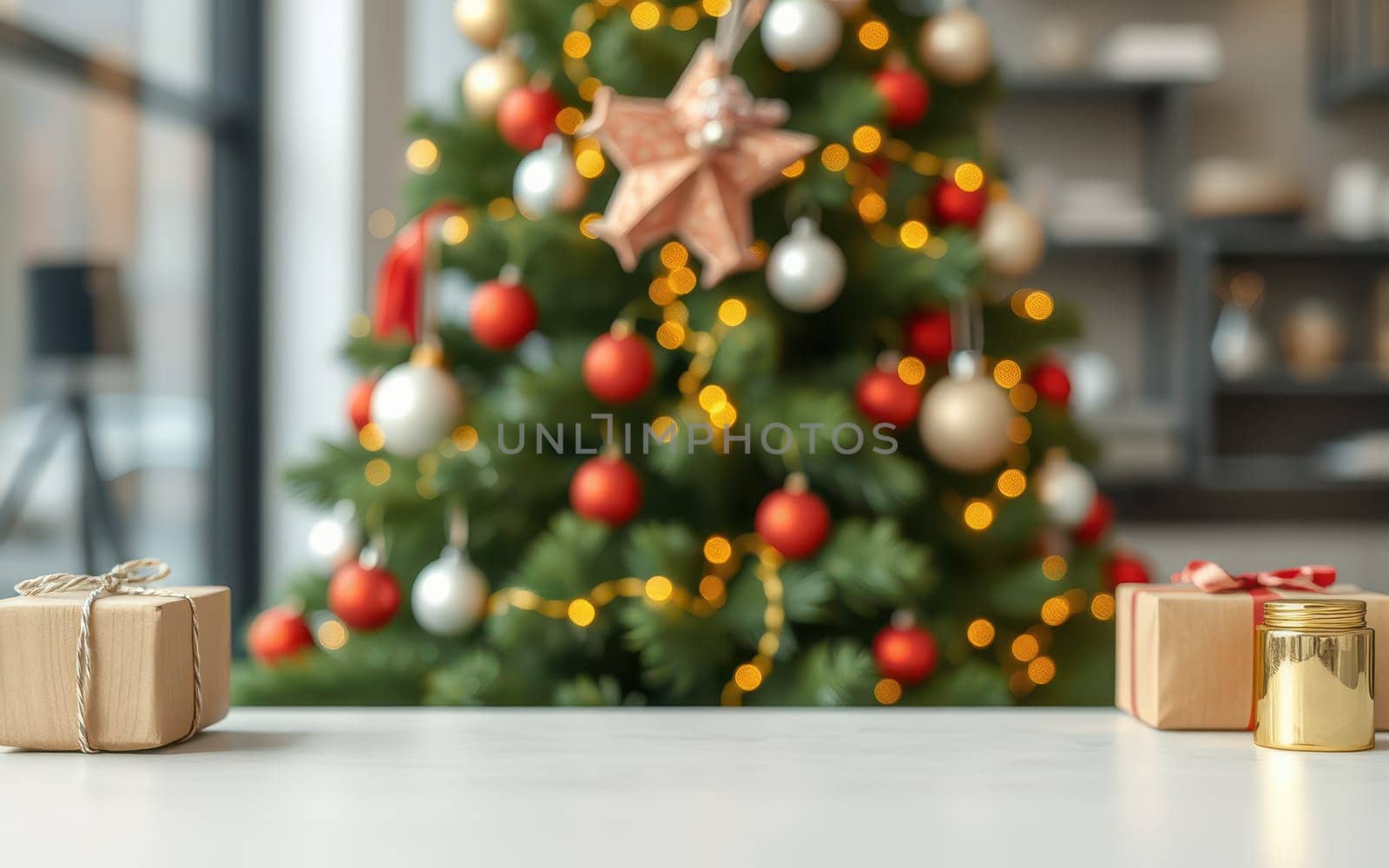 Festive gifts wrapped in brown paper sit on a table in a warm room, with a vibrant Christmas tree in the background, embellished with ornaments and lights.