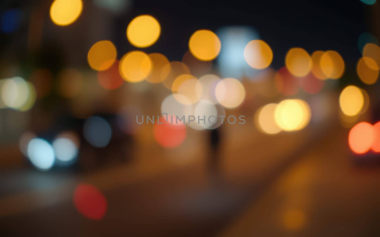 Bright, colorful orbs of light illuminate a lively city street at night. Cars and pedestrians move, creating a dynamic atmosphere full of energy and life.
