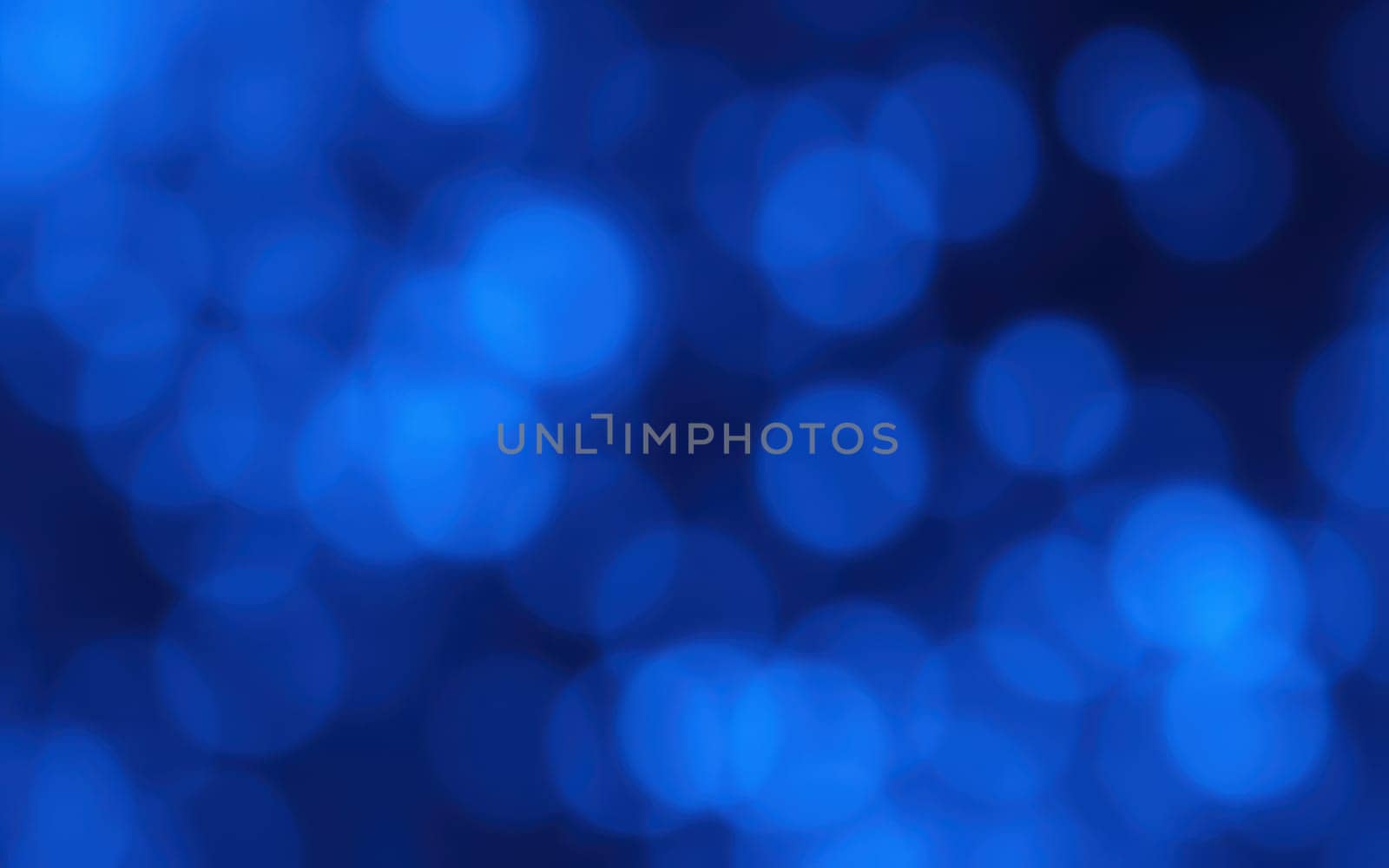 Soft blue bokeh lights blend seamlessly, creating a tranquil backdrop suitable for presentations, websites, or artistic endeavors. The gentle glow enhances visual appeal.