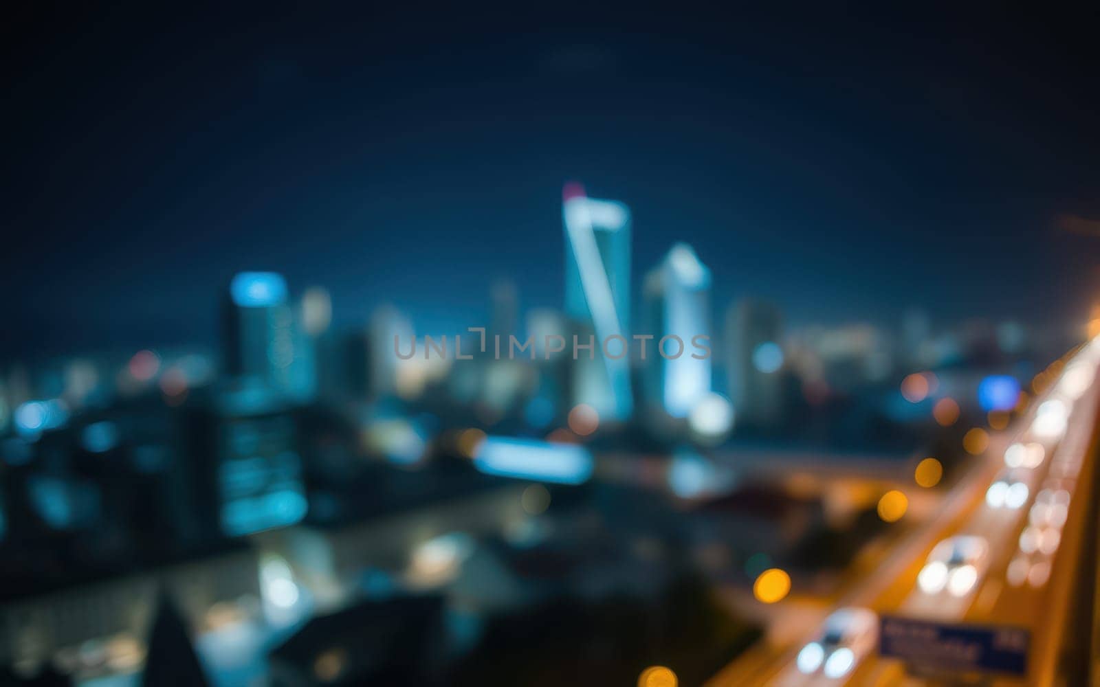 The skyline showcases vibrant city lights and modern buildings illuminated against a dark sky. Traffic flows seamlessly along the busy streets, creating a dynamic urban atmosphere.