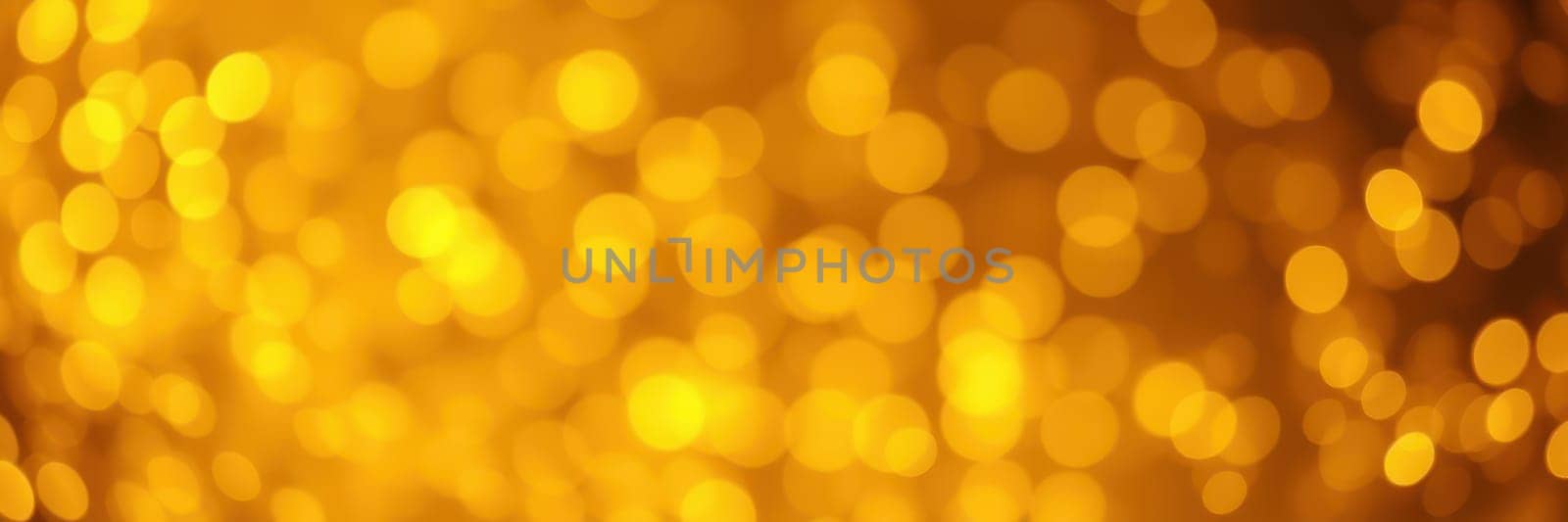 A collection of golden bokeh lights creates a vibrant and festive atmosphere, enhancing the mood for celebrations such as parties or holidays. The luminous glow captivates the viewer.
