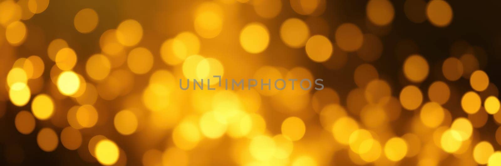 Soft golden bokeh lights fill the dark space, creating a warm and inviting atmosphere for a nighttime celebration or gathering. The lights twinkle gently.