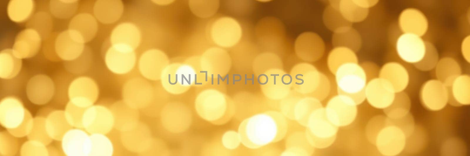 A multitude of soft, glowing golden lights creates a warm and festive ambiance, illuminating the surroundings during a joyful celebration at night.