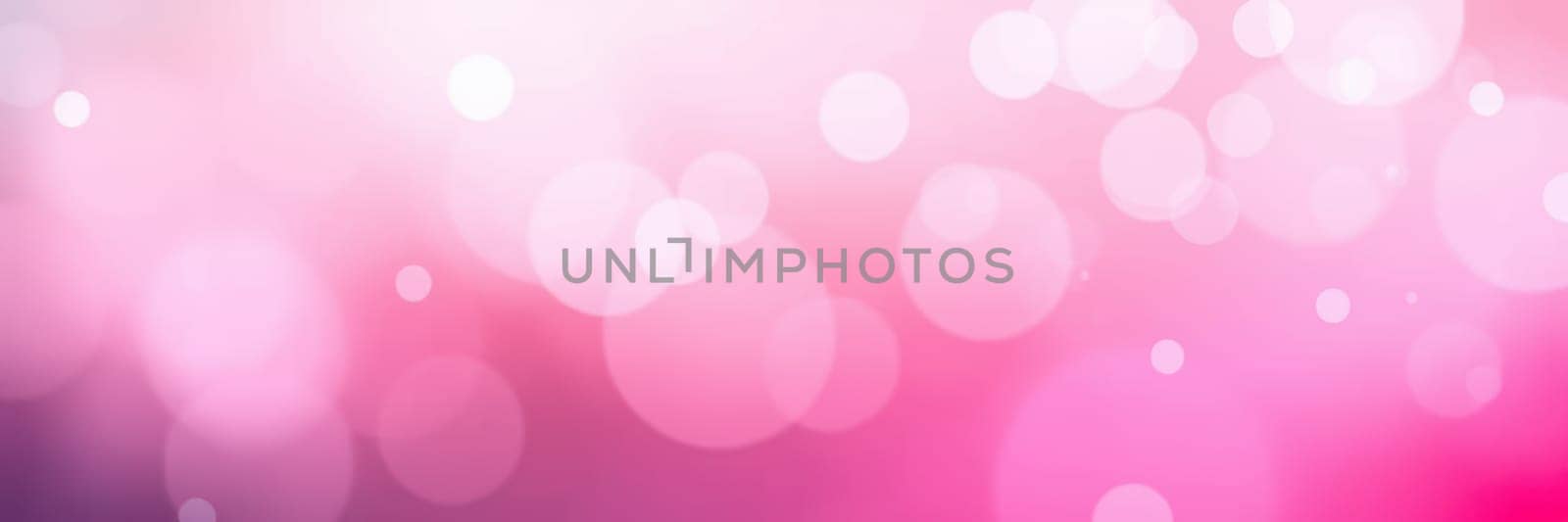 The background features soft pink hues with numerous blurred light circles creating a warm, dreamy effect perfect for celebrations or artistic designs.