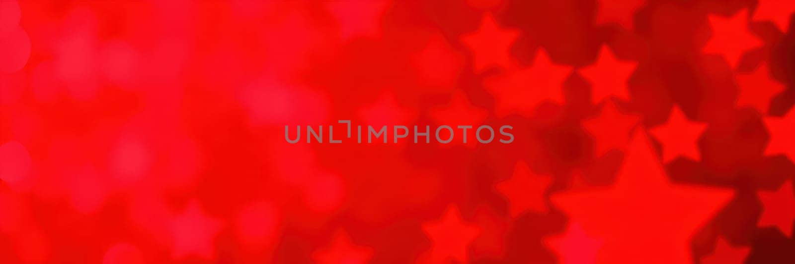 A vibrant red backdrop filled with star shapes creates a cheerful atmosphere, perfect for celebrations, parties, or festive gatherings under the night sky.