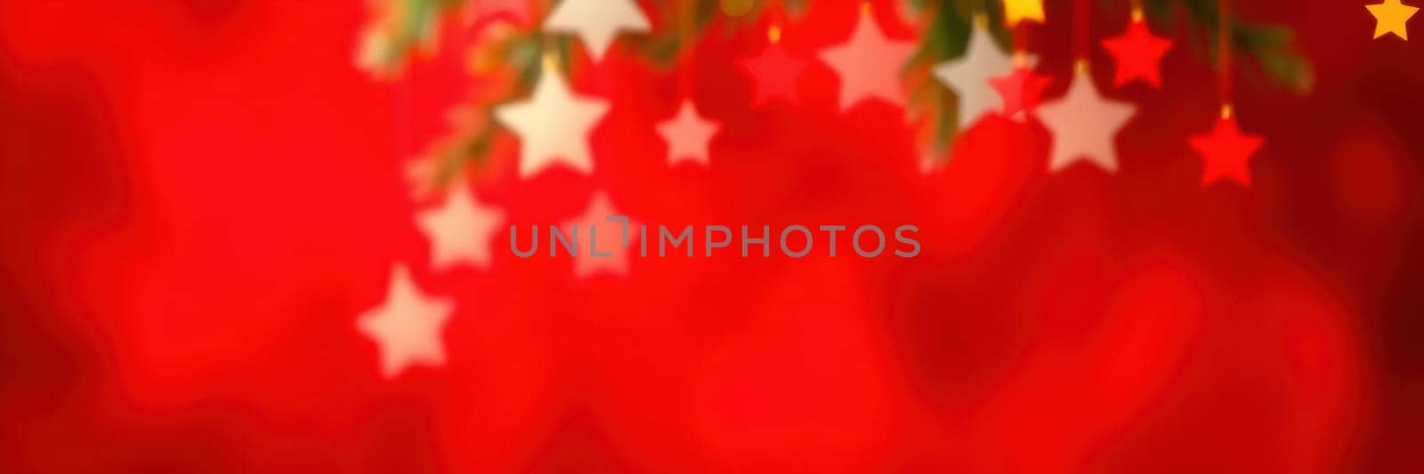 Brightly colored stars dangle against a red backdrop, creating a joyful atmosphere typical of festive seasons. This decoration adds cheer to holiday events.