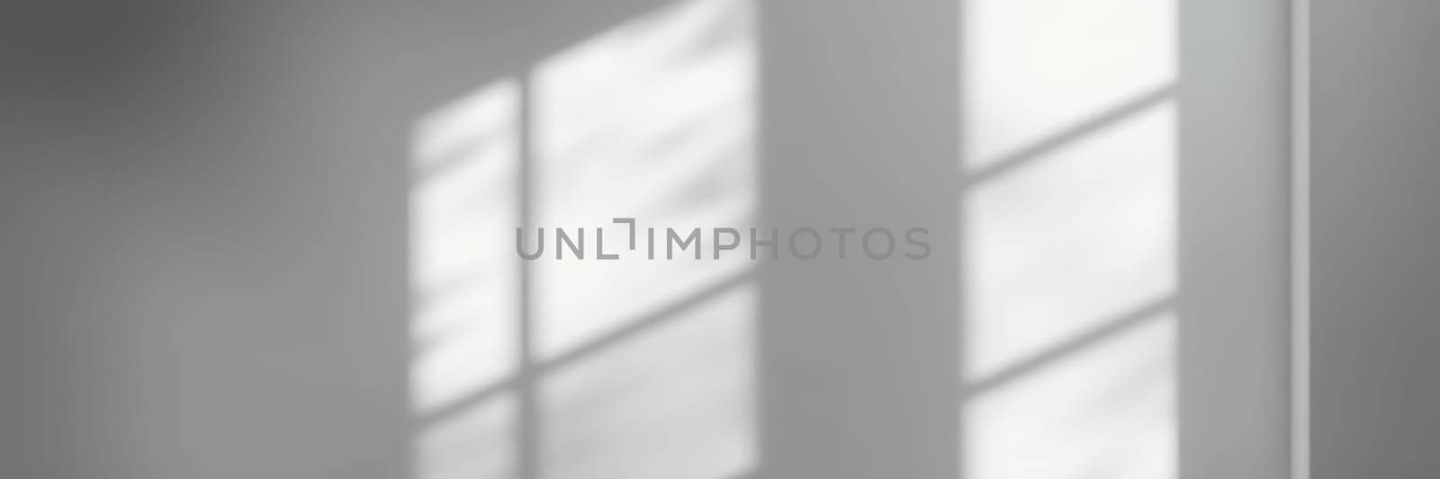 Soft rays of sunlight filter through a large window, casting gentle shadows on the floor. The ambiance creates a peaceful and calming atmosphere within this indoor space.