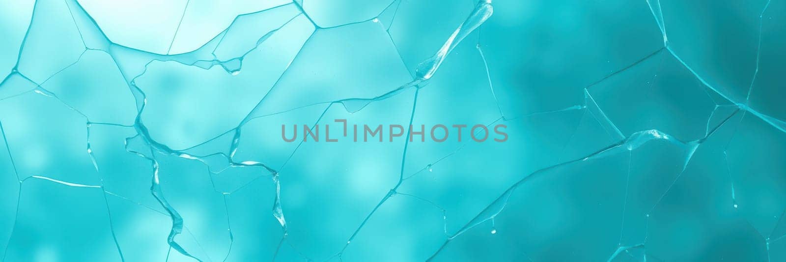 Shattered turquoise glass pieces capture and refract light in a captivating way. The interplay of colors and fractures creates an intriguing abstract art piece.