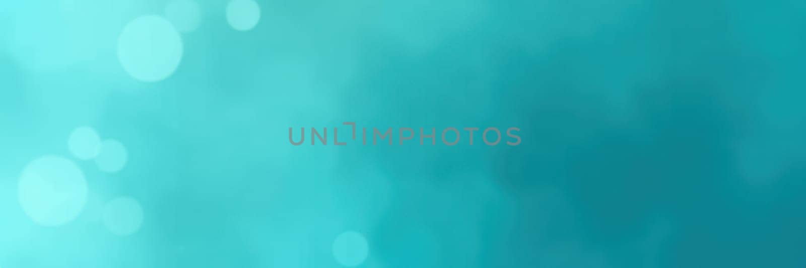 A bright turquoise backdrop is enhanced by soft bokeh effects, creating a tranquil and inviting ambiance perfect for various design projects or presentations.