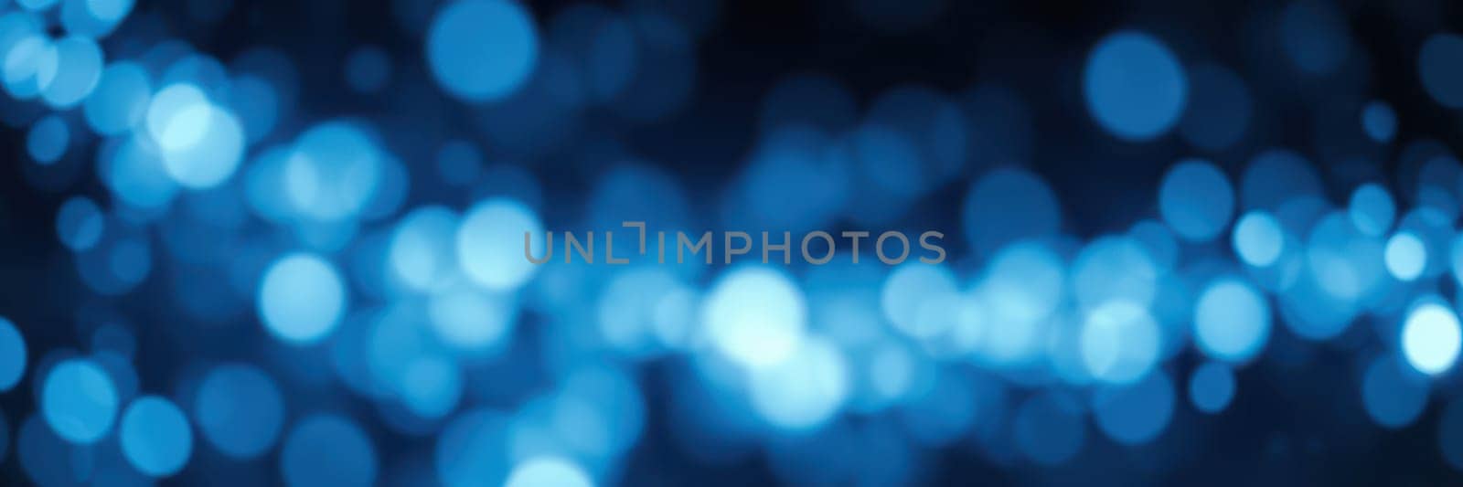 Soft blue bokeh lights shimmer in the background, creating an enchanting atmosphere perfect for artistic projects or celebrations. The gradual focus adds depth and intrigue.
