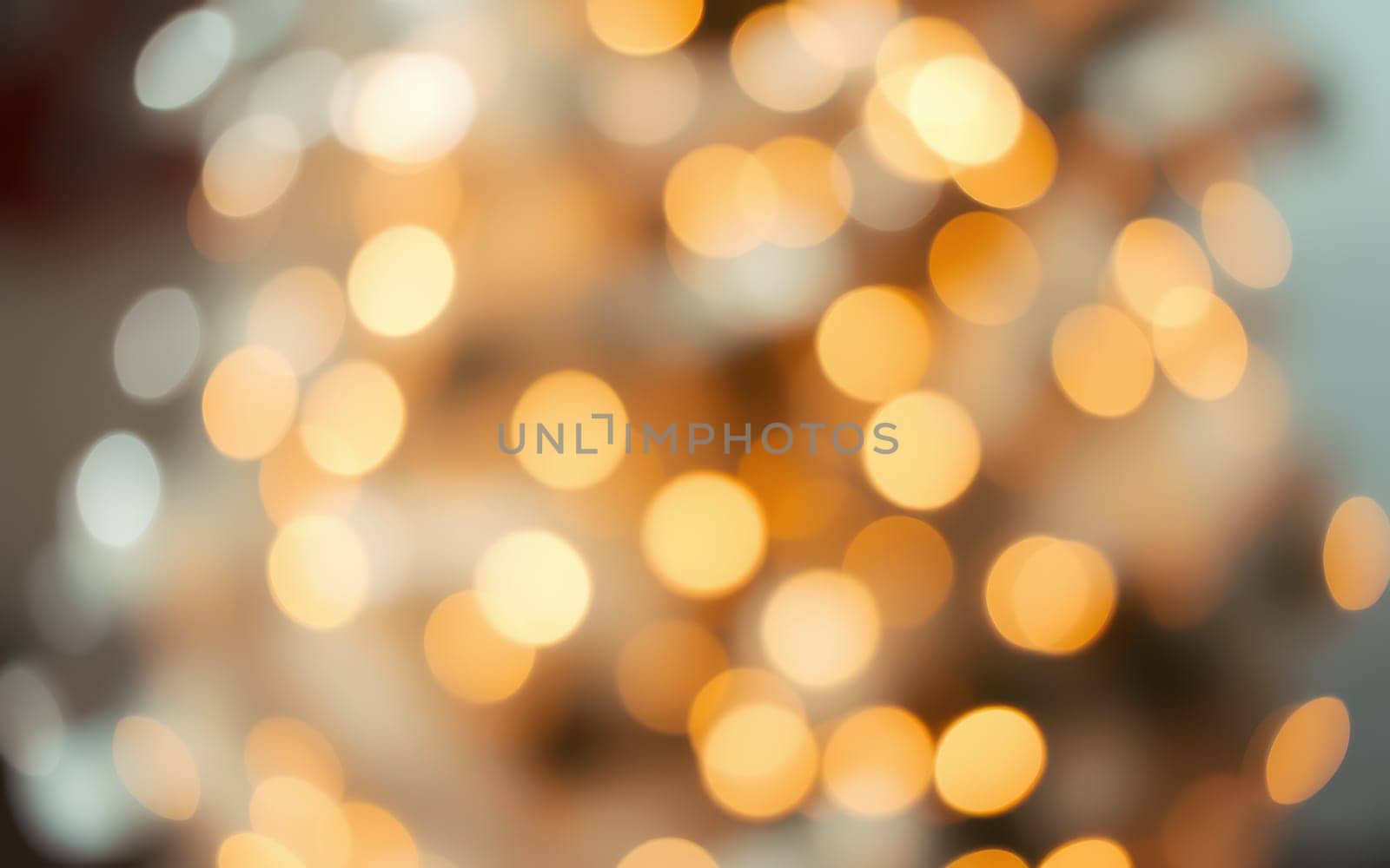 Softly glowing bokeh lights fill the space with warmth, creating a festive ambiance perfect for a holiday gathering. The blurred effect enhances the cozy feel of the room.