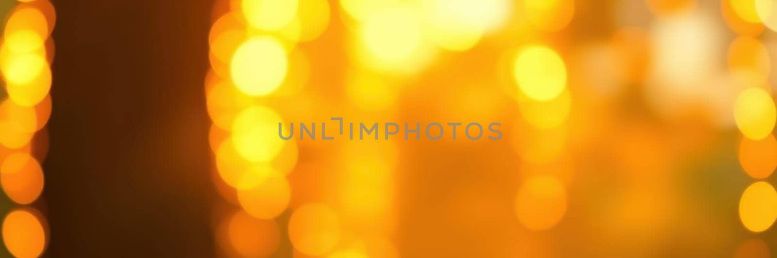 A bustling urban environment is filled with warm golden lights, setting a festive and joyous atmosphere as people gather for an evening celebration, enjoying the ambiance.