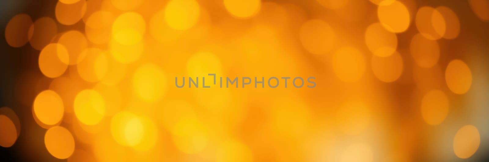 A soft, glowing background of golden bokeh lights adds a festive and cozy ambiance to an evening event, enhancing the atmosphere for celebration and connection among guests.